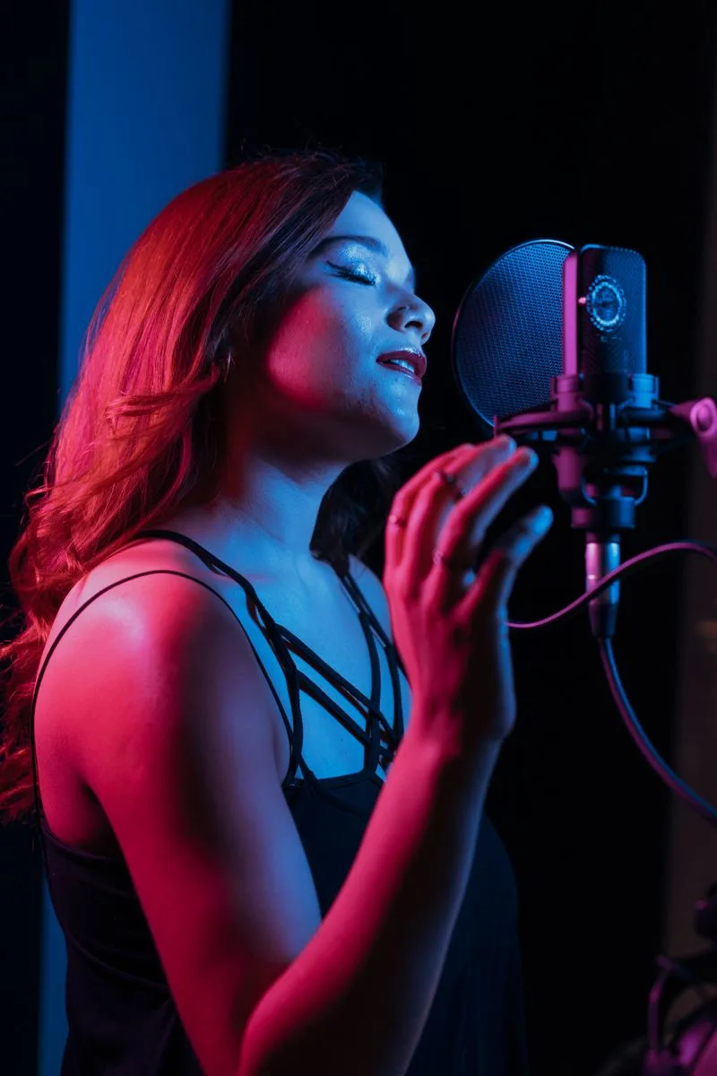 Singer performing in a colorful recording studio
